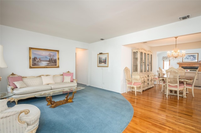 745 Willow Rd, Franklin Square, NY 11010 - living room featuring a chandelier and light wood-style floors