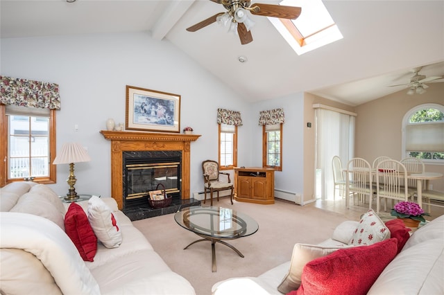 745 Willow Rd, Franklin Square, NY 11010 - living area with baseboard heating, ceiling fan, a skylight, and a premium fireplace