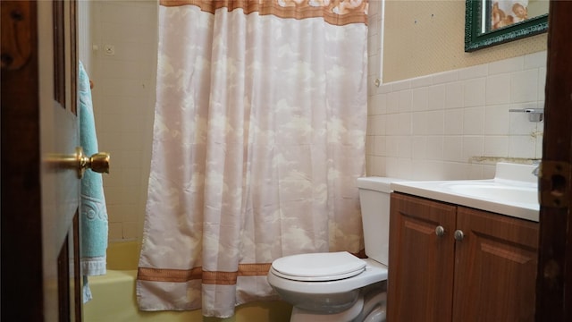 15 Sabra Ln, Wappingers Falls, NY 12590 - bathroom with tile walls, toilet, vanity, and shower / tub combo