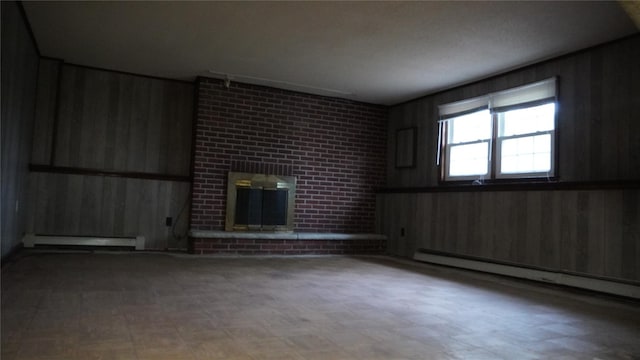 15 Sabra Ln, Wappingers Falls, NY 12590 - unfurnished living room with wooden walls, baseboard heating, and a fireplace