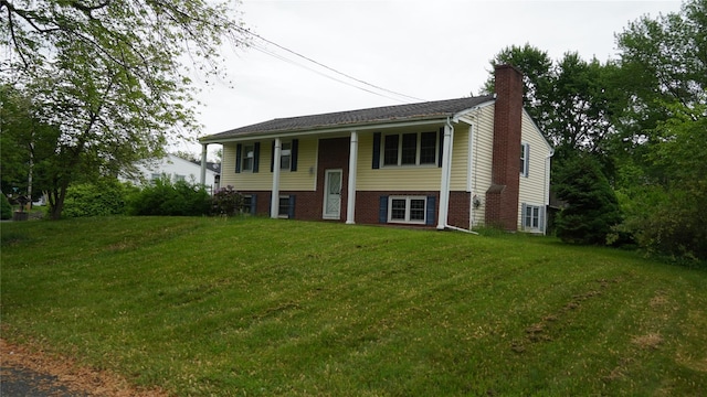 15 Sabra Ln, Wappingers Falls, NY 12590 - bi-level home with a front lawn and a chimney