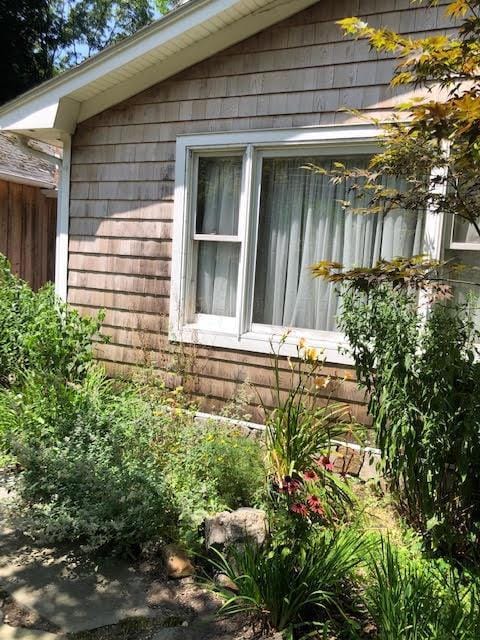 view of side of property featuring fence