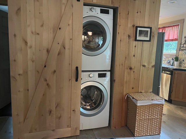 laundry area with estacked washer and dryer