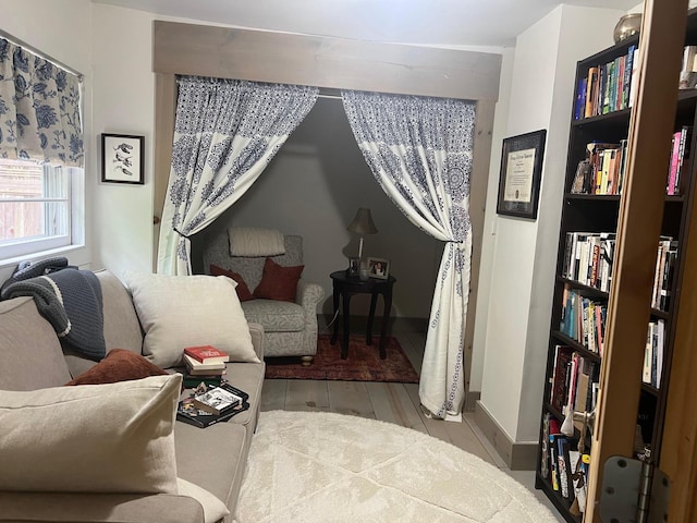 living room with wood finished floors and baseboards