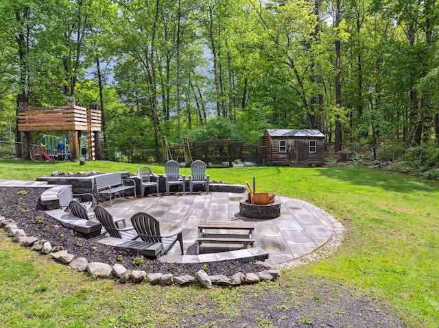 162 Forest Hill Dr, Kingston, NY 12401 - view of yard with an outdoor fire pit, a playground, a patio area, and an outbuilding