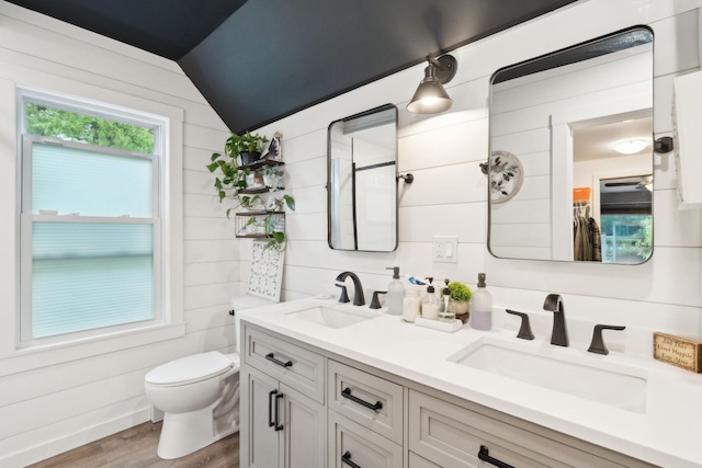 162 Forest Hill Dr, Kingston, NY 12401 - full bathroom featuring toilet, wood finished floors, lofted ceiling, and double vanity