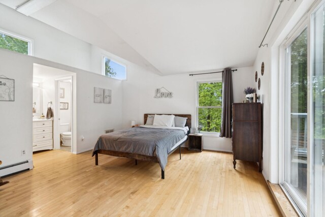 162 Forest Hill Dr, Kingston, NY 12401 - bedroom featuring light wood-type flooring, lofted ceiling, connected bathroom, and a baseboard radiator