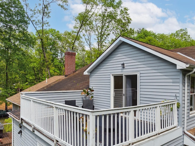 162 Forest Hill Dr, Kingston, NY 12401 - rear view of property featuring a shingled roof, a wooden deck, and a chimney