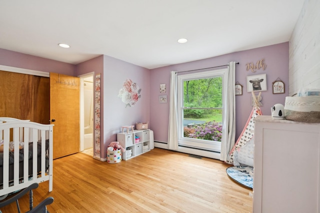 162 Forest Hill Dr, Kingston, NY 12401 - bedroom with a baseboard radiator, wood finished floors, and recessed lighting