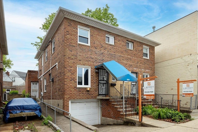 25-31/33 Francis Lewis Blvd, Whitestone, NY 11358 - view of front of house featuring a garage and brick siding