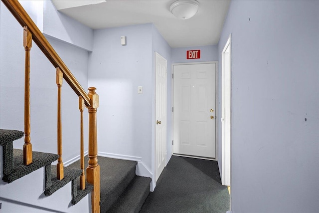 25-31/33 Francis Lewis Blvd, Whitestone, NY 11358 - entryway featuring dark carpet, stairway, and baseboards