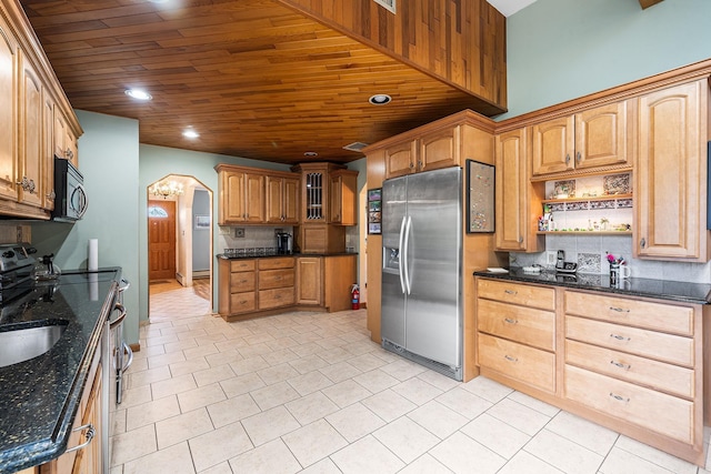 105 Farmers Ave, Plainview, NY 11803 - kitchen featuring stainless steel appliances, arched walkways, wooden ceiling, decorative backsplash, and light tile patterned floors