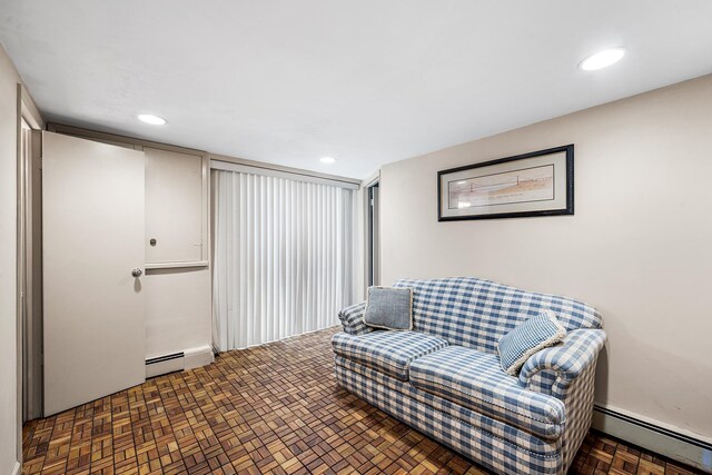 105 Farmers Ave, Plainview, NY 11803 - living area featuring a baseboard heating unit and recessed lighting
