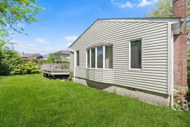 105 Farmers Ave, Plainview, NY 11803 - view of property exterior featuring a wooden deck, a chimney, a yard, and crawl space