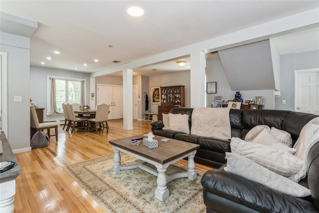 161 W Walnut St, Long Beach, NY 11561 - living area with light wood finished floors, recessed lighting, and a baseboard heating unit