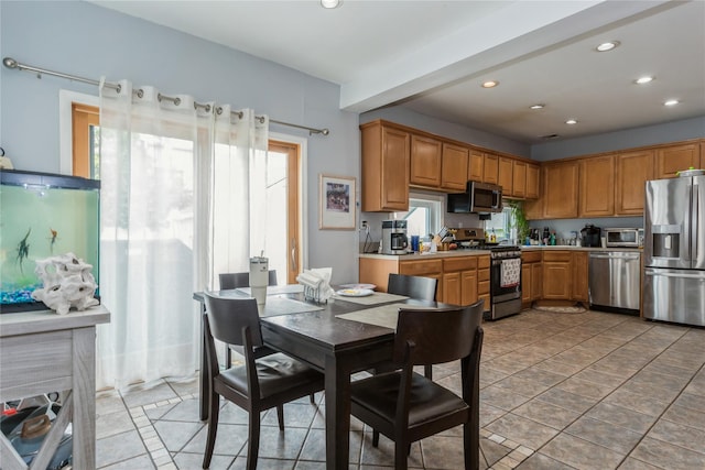 161 W Walnut St, Long Beach, NY 11561 - kitchen with stainless steel appliances, recessed lighting, light countertops, and brown cabinets