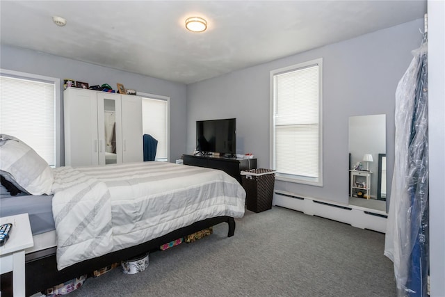 161 W Walnut St, Long Beach, NY 11561 - carpeted bedroom with a baseboard heating unit