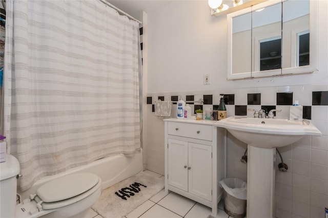 161 W Walnut St, Long Beach, NY 11561 - full bathroom featuring tile walls, toilet, tile patterned floors, shower / bathtub combination with curtain, and wainscoting