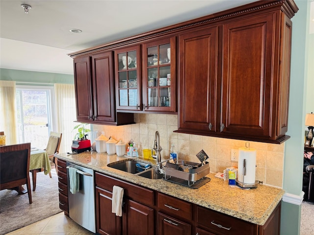 211 Pond Cir, Mount Sinai, NY 11766 - kitchen featuring stainless steel dishwasher, a sink, light stone countertops, glass insert cabinets, and light colored carpet