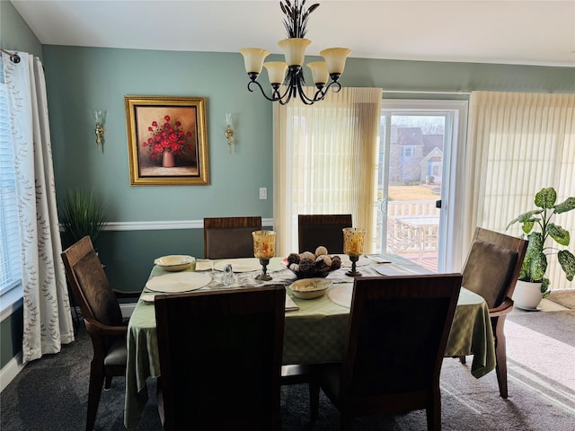 211 Pond Cir, Mount Sinai, NY 11766 - dining space featuring carpet, a chandelier, and baseboards