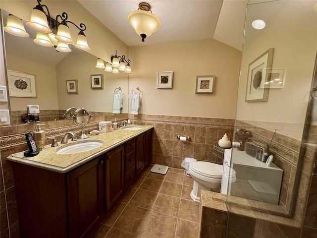 211 Pond Cir, Mount Sinai, NY 11766 - bathroom with tile walls, toilet, tile patterned flooring, vaulted ceiling, and wainscoting