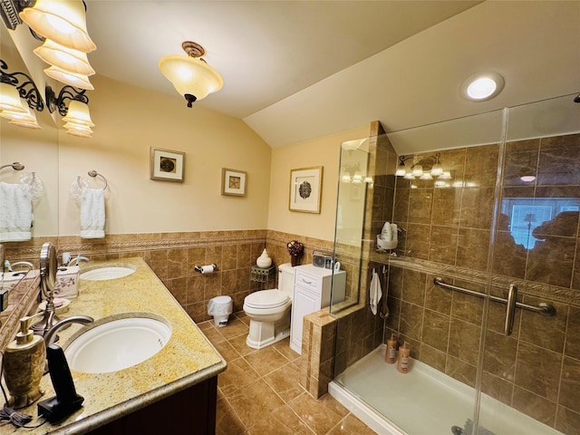 211 Pond Cir, Mount Sinai, NY 11766 - full bath featuring vaulted ceiling, toilet, tile walls, tiled shower, and double vanity