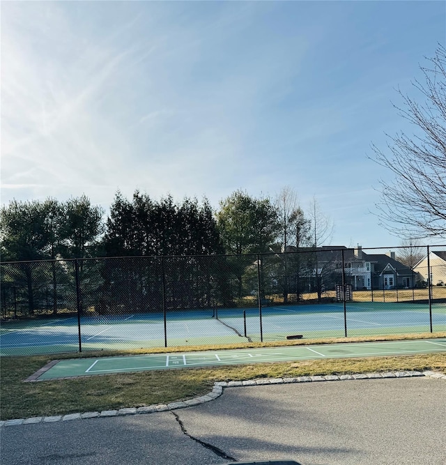 211 Pond Cir, Mount Sinai, NY 11766 - view of tennis court featuring fence