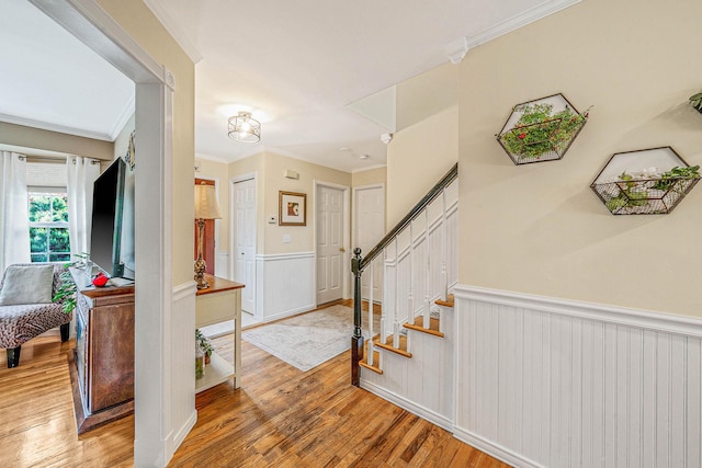 8 Emerald Ct, Moriches, NY 11955 - staircase with crown molding, wainscoting, and wood finished floors