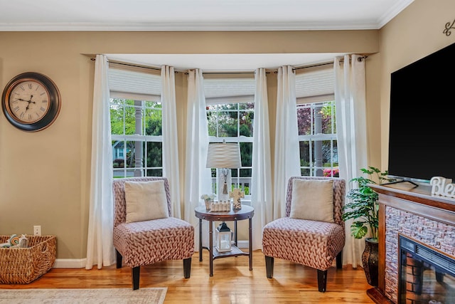 8 Emerald Ct, Moriches, NY 11955 - sitting room featuring wood finished floors, ornamental molding, and a stone fireplace
