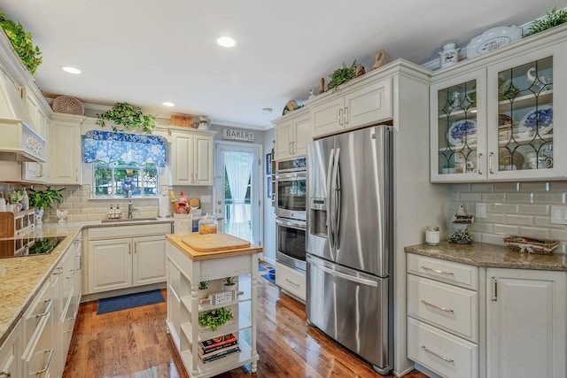 8 Emerald Ct, Moriches, NY 11955 - kitchen with appliances with stainless steel finishes, a sink, tasteful backsplash, recessed lighting, and wood finished floors