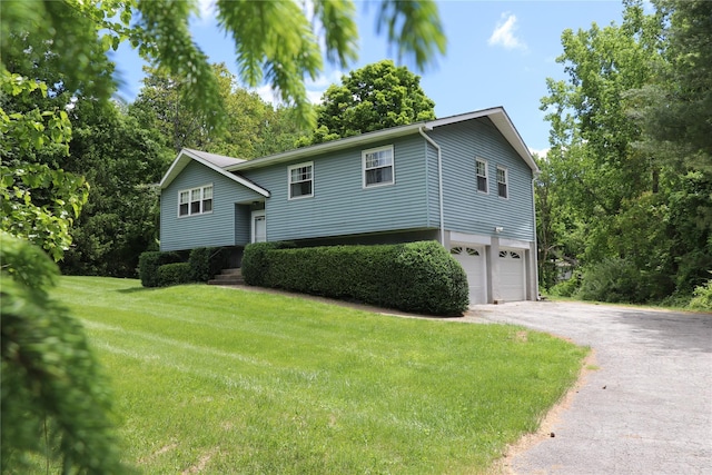 25 Cypher Ln, Poughquag, NY 12570 - bi-level home featuring an attached garage, driveway, and a front yard