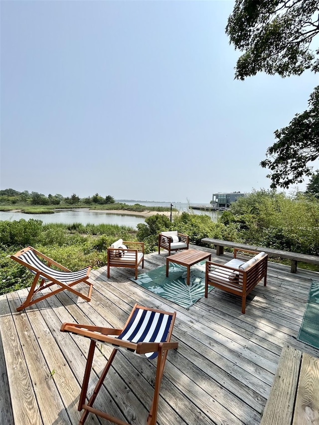 55 W End Ave, East Quogue, NY 11942 - wooden deck with a water view and an outdoor hangout area