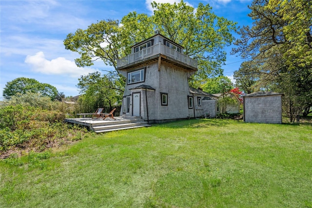 55 W End Ave, East Quogue, NY 11942 - back of property featuring a yard, a deck, and a balcony