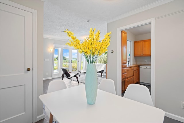 55 W End Ave, East Quogue, NY 11942 - dining room featuring ornamental molding, baseboards, and a textured ceiling