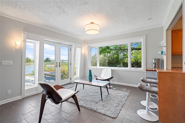 55 W End Ave, East Quogue, NY 11942 - home office with ornamental molding, baseboards, a textured ceiling, a water view, and french doors