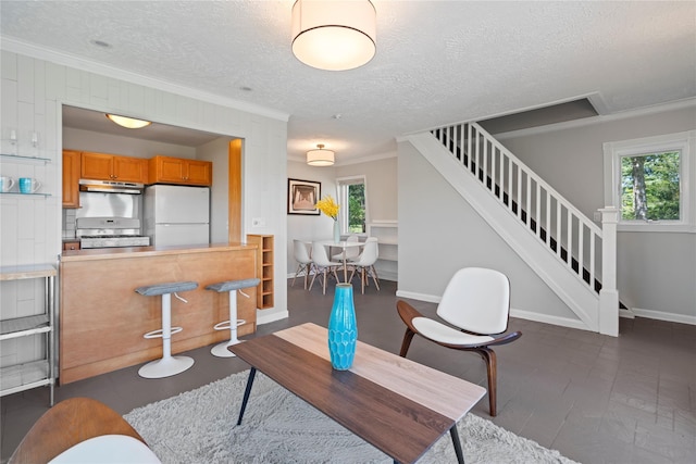 55 W End Ave, East Quogue, NY 11942 - living area with crown molding, stairs, a textured ceiling, and baseboards