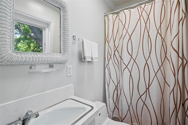 55 W End Ave, East Quogue, NY 11942 - bathroom with toilet, crown molding, and a shower with shower curtain
