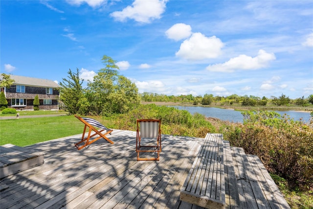 55 W End Ave, East Quogue, NY 11942 - wooden deck with a water view and a lawn