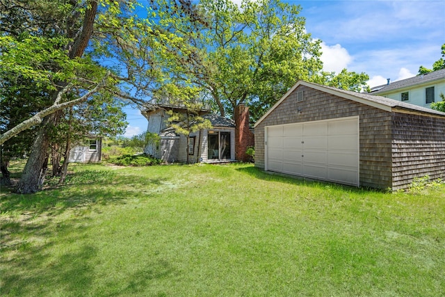 55 W End Ave, East Quogue, NY 11942 - view of green lawn featuring an outdoor structure and a detached garage