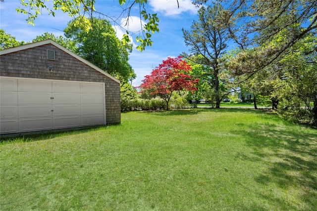 55 W End Ave, East Quogue, NY 11942 - view of grassy yard featuring an outdoor structure and a garage