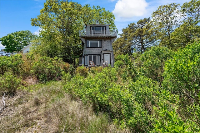 55 W End Ave, East Quogue, NY 11942 - view of front of home featuring a balcony