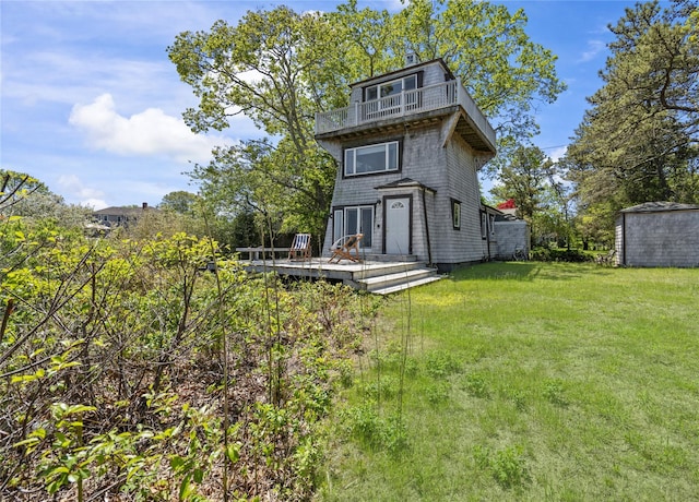 55 W End Ave, East Quogue, NY 11942 - rear view of house with a balcony, a yard, and a deck