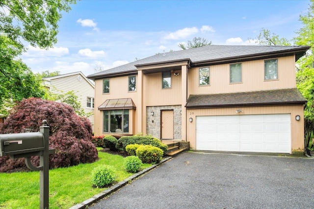 29 Sunset Rd S, Albertson, NY 11507 - view of front of property with a garage, driveway, a shingled roof, and stone siding