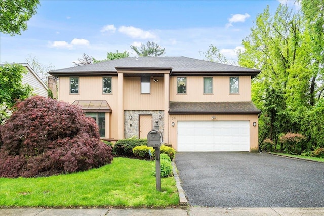 29 Sunset Rd S, Albertson, NY 11507 - view of front facade with a garage, asphalt driveway, roof with shingles, and a front yard