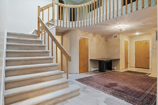 29 Sunset Rd S, Albertson, NY 11507 - stairs featuring marble finish flooring, baseboard heating, and a baseboard heating unit