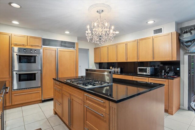 29 Sunset Rd S, Albertson, NY 11507 - kitchen with appliances with stainless steel finishes, light tile patterned flooring, a chandelier, a kitchen island, and recessed lighting