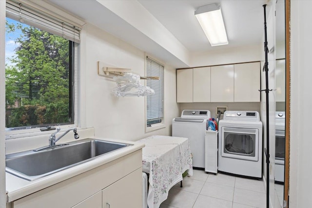 29 Sunset Rd S, Albertson, NY 11507 - laundry room featuring separate washer and dryer, cabinet space, and light tile patterned flooring