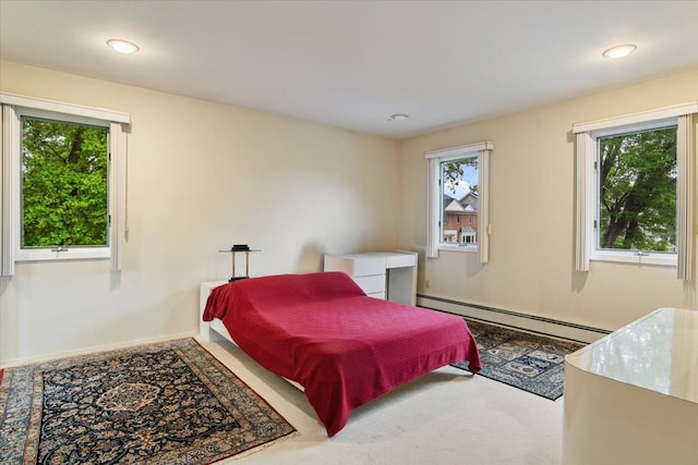 29 Sunset Rd S, Albertson, NY 11507 - bedroom featuring multiple windows, a baseboard radiator, recessed lighting, baseboards, and carpet floors