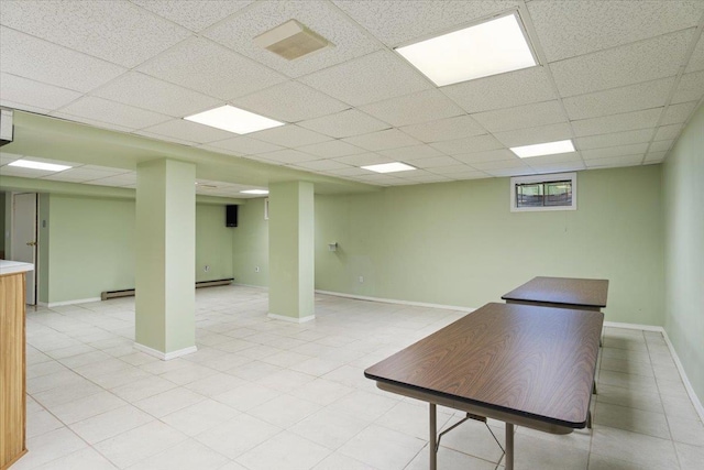 29 Sunset Rd S, Albertson, NY 11507 - finished basement with a baseboard heating unit, a paneled ceiling, baseboards, and baseboard heating