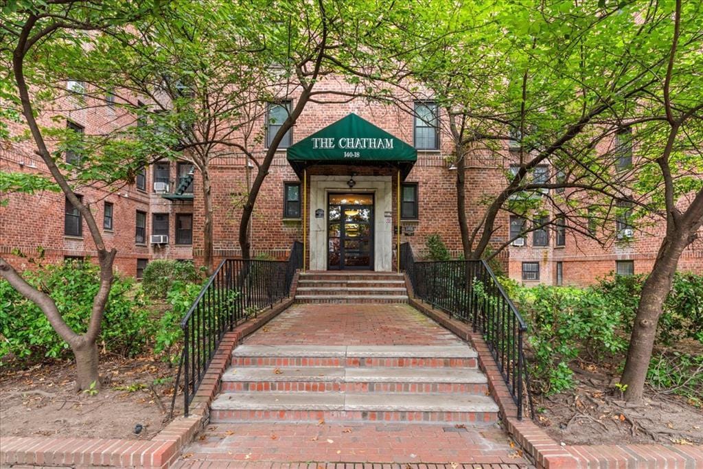 entrance to property with brick siding